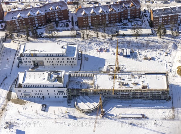 Aerial view, snow, winter, construction area Paracelsuspark with innovation centre, SCI:Q Science