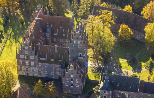 Aerial view, Heessen Castle with public school and boarding school in the autumnal forest in the