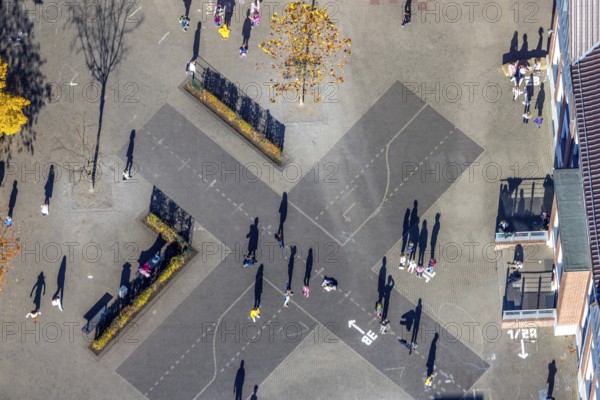 Aerial view, Overbergschule and pupils and cross on the schoolyard in the district Bockum-Hövel in