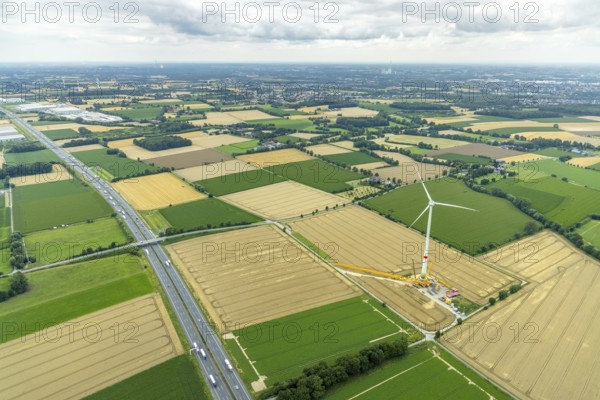 Aerial view, meadows and fields with construction site and new wind turbine, Rhynern, Hamm, Ruhr