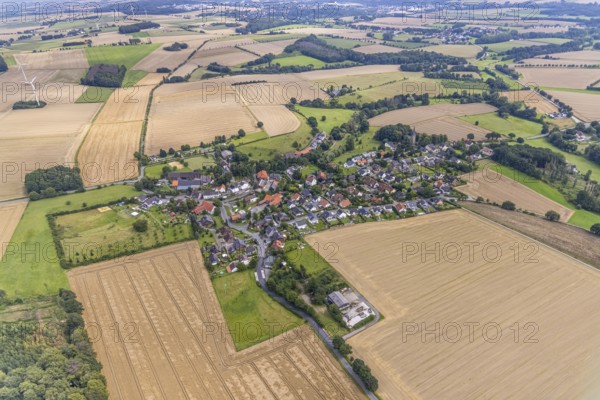 Aerial view, village view with protestant village church at the cemetery and catholic church St.