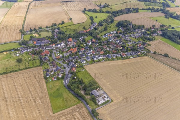 Aerial view, village view with protestant village church at the cemetery and catholic church St.