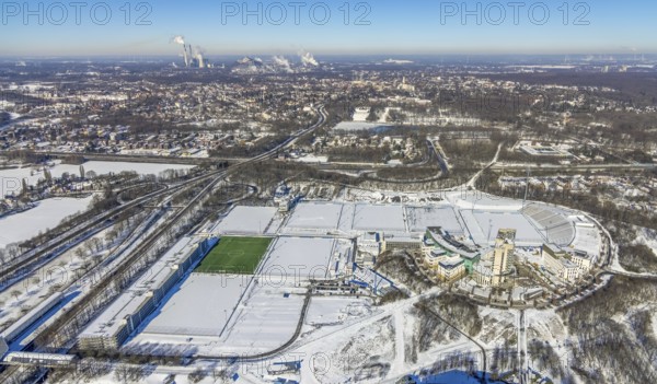 Aerial view, training ground and park stadium in the snow at the Veltins-Arena, Hotel Courtyard by