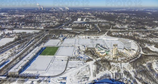 Aerial view, training ground and park stadium in the snow at the Veltins-Arena, Hotel Courtyard by