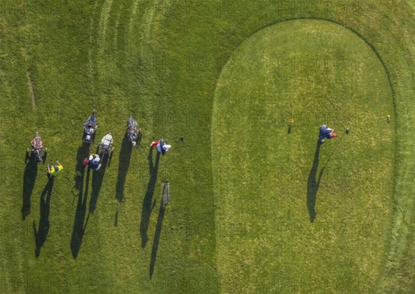 Aerial view, golf course golf club Schloss Horst and golf player on the green in the district Horst