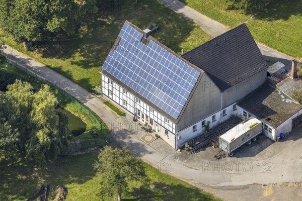 Aerial view, half-timbered house with solar roof in Oberhülsenbecke in the district Rüggeberg in