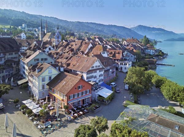 Old town with the Landsgemeindeplatz surrounded by street cafés and restaurants, behind the