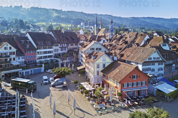Old town with the Landsgemeindeplatz surrounded by street cafés and restaurants, behind the