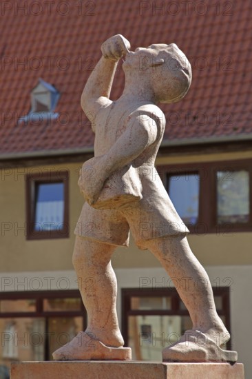 Juice boy at the market fountain, symbolising the historical supply of drinking water, boy