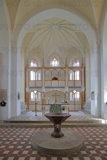 Baptismal font and chancel, interior view of the neo-Gothic St Peter's Church, UNESCO,