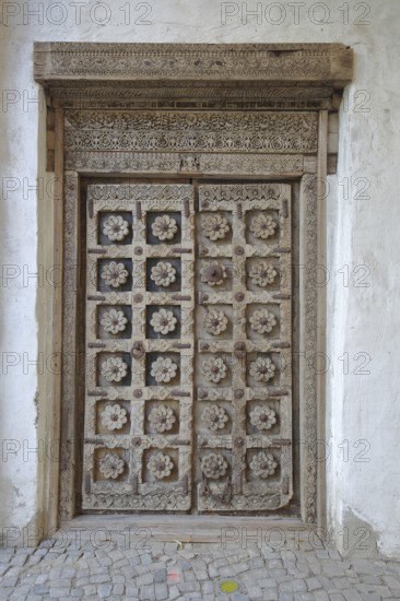 Door with wood carvings and floral decorations, castle, Wanzleben, Romanesque Road, Saxony-Anhalt,