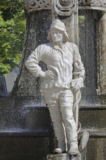 Miner at the market fountain, male figure with hammer and helmet, symbol, industry, sculpture,