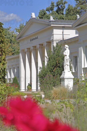 Classicist lime tree bath with columns, blooming flower, depth of field, blur, saltwater park, spa