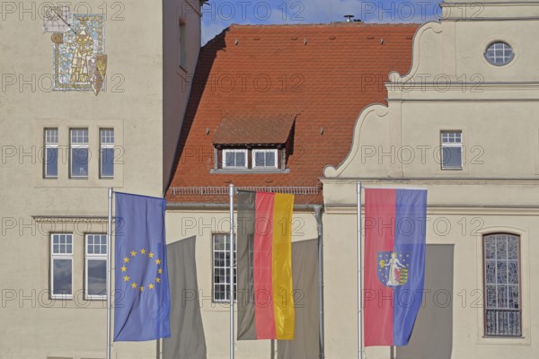 Renaissance town hall with EU flag, German national flag and town flag, three, flags, Coswig,