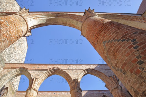Interior view of the St Bartholomäi church ruins, view upwards, open, archways, columns, pillars,