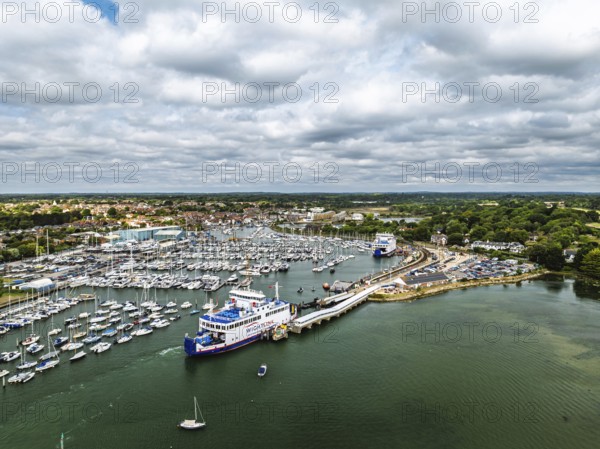 Wight Light car ferry to Isle of Wight on Lymington River and marina from drone, Lymington, New