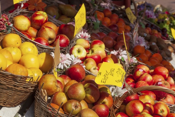 Fresh apples and fresh fruit with price tags in baskets in front of a greengrocer's shop, Bremen,