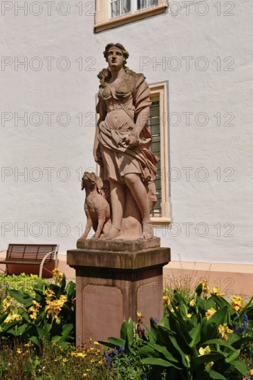 Ettlingen, Germany - August 2025: Sculpture of hunting goddess Diana in the castle garden of