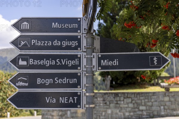 Signpost in the village to the museum, Via NEAT, church, Sedrun, Surselva, Graubünden, Switzerland