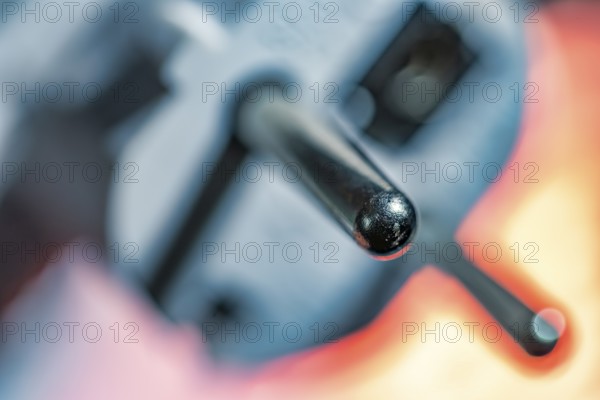 Close-up of a power plug, Schuko plug, with focus on the contact pins, symbol image for,
