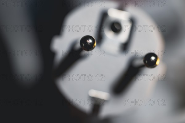 Close-up of a power plug, Schuko plug, with focus on the contact pins, symbol image for,