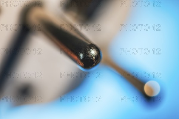 Close-up of a power plug, Schuko plug, with focus on the contact pins, symbol image for,
