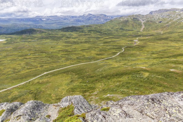 Gravel road through Jotunheimen National Park, view from Smørkollen mountain, Beitostølen,