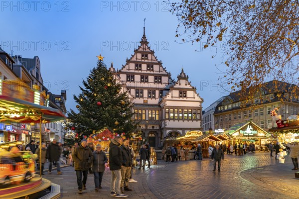 Christmas market at the colourfully illuminated Paderborn Town Hall at duskin Paderborn, North