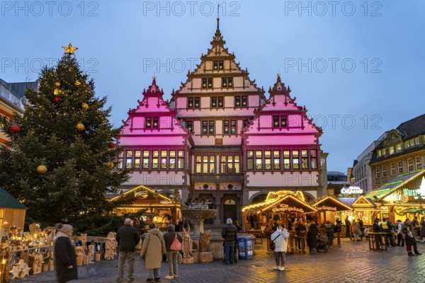 Christmas market at the colourfully illuminated Paderborn Town Hall at duskin Paderborn, North