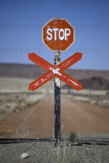 Stop sign at an ungated level crossing on the Lüderitz-Keetmanshoop railway line, near Goageb,