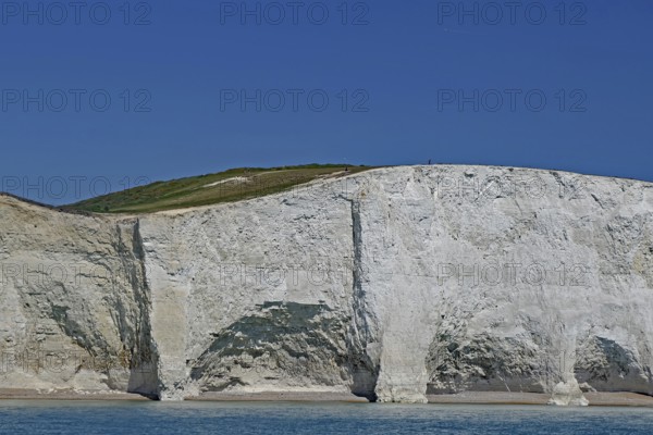 White cliff landscape with blue sky and calm sea, Old Harrys Rock, Beachy Head Lighthouse,
