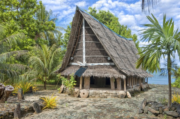Traditional historical meeting house for men Tribal Chief Men Men's House between palm trees, in