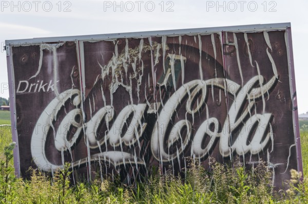 Old advertising sign Drikk Coca-Cola in a field, advertising for Coca-Cola, Jessheim, UIllensaker,