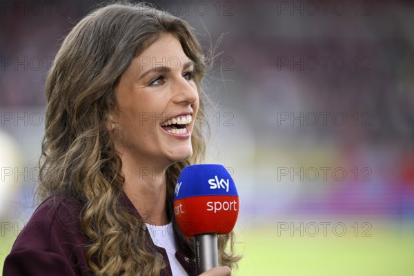 SKY presenter Mara Mones, portrait, smiles, interview, microphone, mike, logo, Voith-Arena,