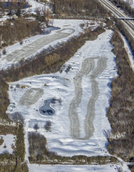 Aerial view, snow-covered golf course Huckingen and walkers, Huckingen, Duisburg, Ruhr area, North