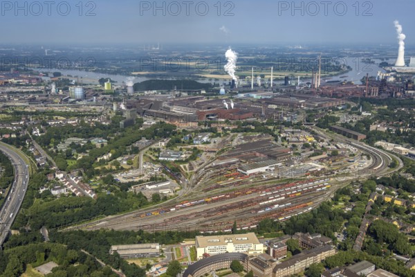 Aerial view, goods train station, thyssenkrupp Steel Europe factory premises, river Rhine with