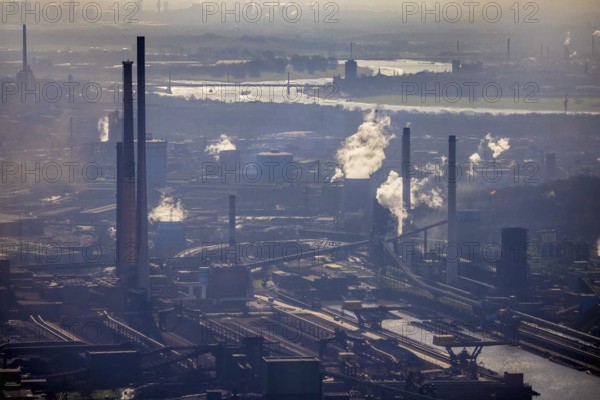 Aerial view, thyssenkrupp Steel Europe backlit, river Rhine, Marxloh, Duisburg, Ruhr area, North