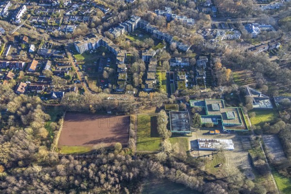 Aerial view of the green school and sports field at the Talaue in the high-rise area Talaue in