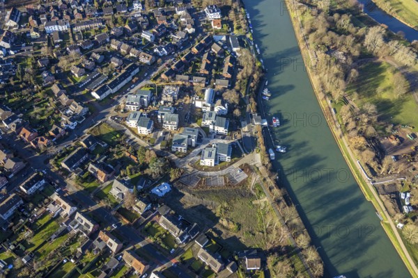 Aerial view of a construction site and new construction of residential buildings with barrier-free