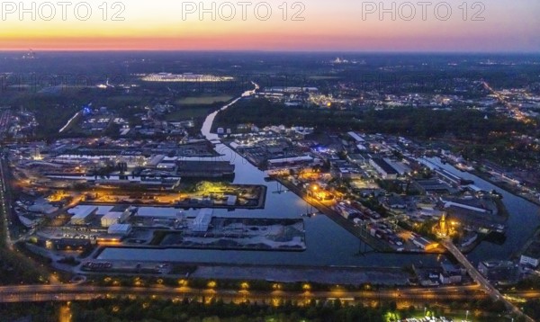 Aerial view, night view of Dortmund harbour, historical building old harbour office, container