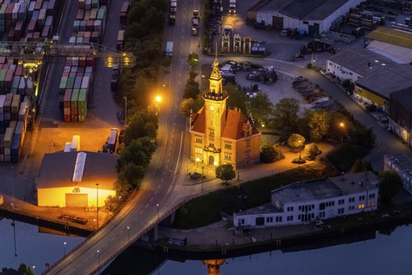 Aerial view, night view of Dortmund harbour, historic building old harbour office, coal port of the