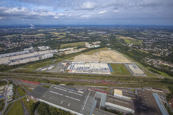 Aerial view, construction site with the new REWE logistics centre on Walzwerkstraße at the old