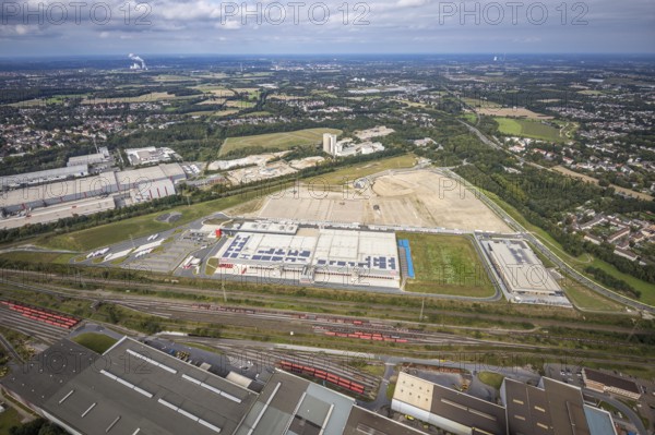 Aerial view, construction site with the new REWE logistics centre on Walzwerkstraße at the old