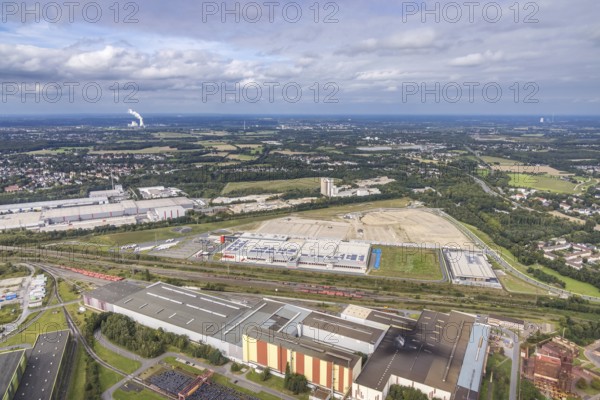 Aerial view, construction site with the new REWE logistics centre on Walzwerkstraße at the old