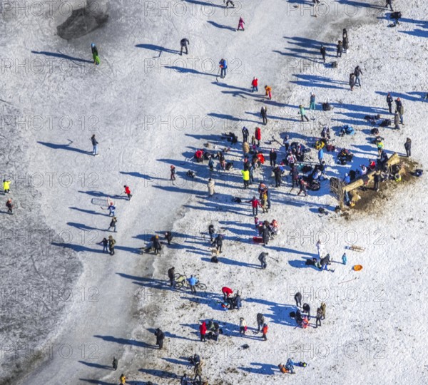 Aerial view, ice rink, ice skaters and pedestrians on frozen Rhine meadow in Lörrick near the