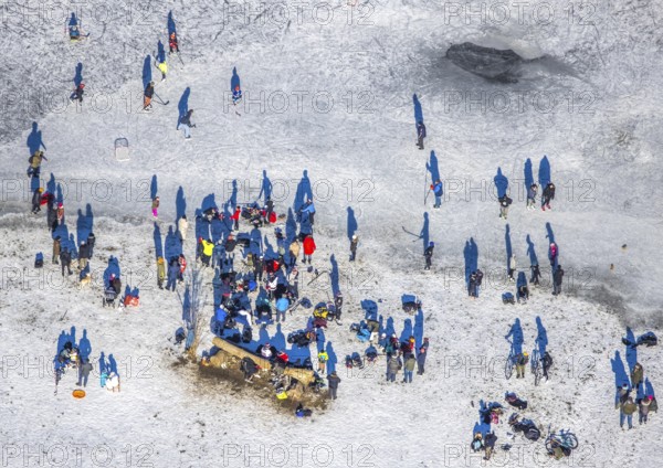 Aerial view, ice rink, ice skaters and pedestrians on frozen Rhine meadow in Lörrick near the