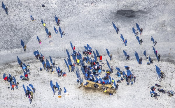 Aerial view, ice rink, ice skaters and pedestrians on frozen Rhine meadow in Lörrick near the