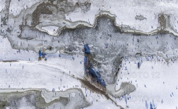 Aerial view, ice rink, ice skaters and pedestrians on frozen Rhine meadow in Lörrick near the