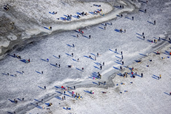 Aerial view, ice rink, ice skaters and pedestrians on frozen Rhine meadow in Lörrick near the