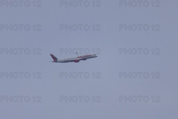 Airbus jet passenger aircraft of Air India airways in flight in a blue sky, London, England, United